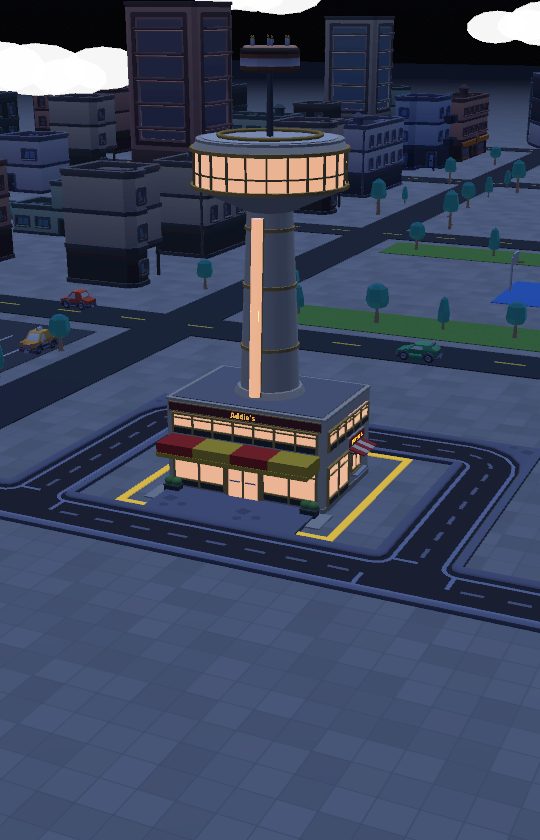 A revolving restaurant lit up at night in the big city